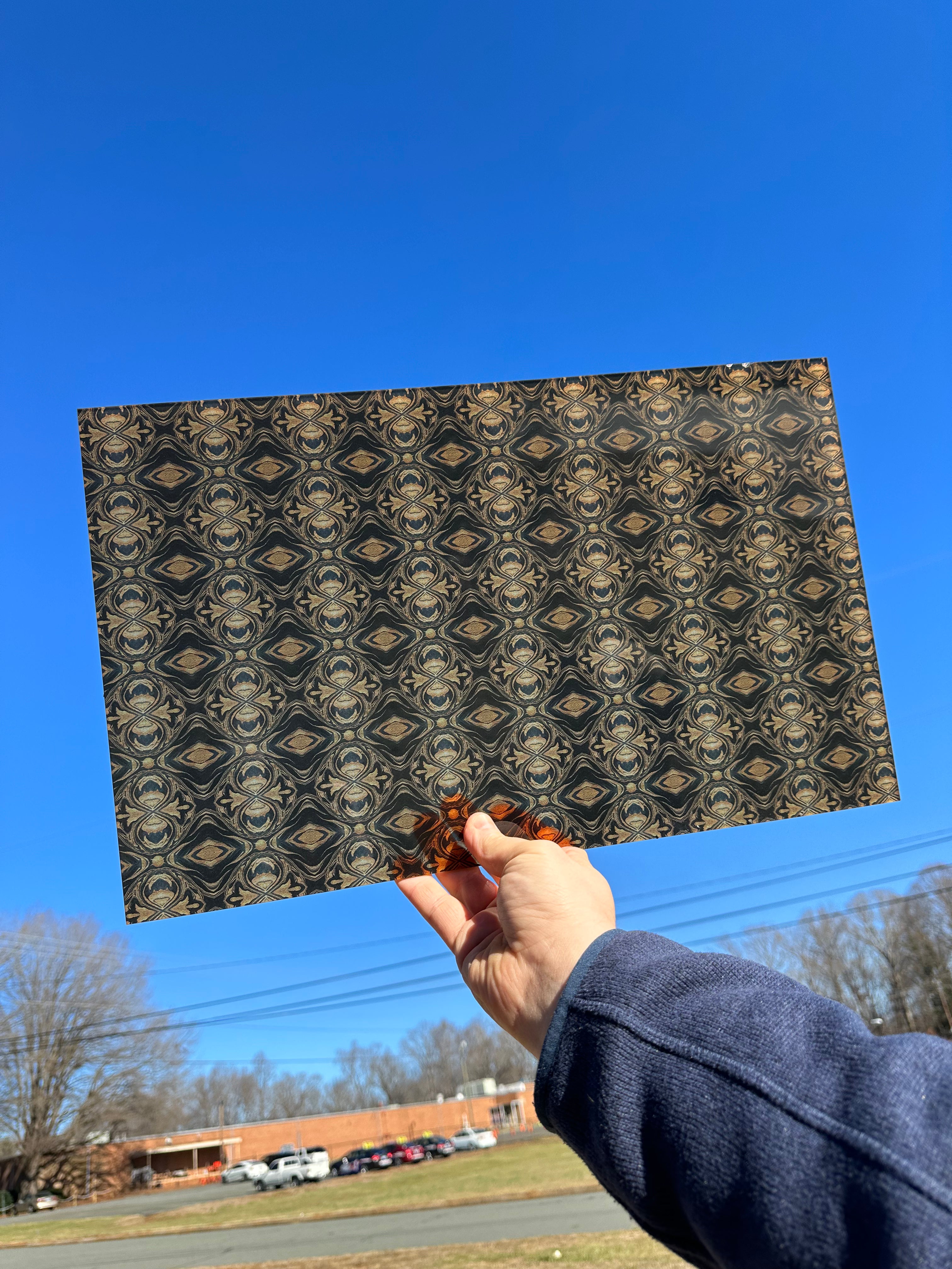 PatternPly® Transparent Black and Gold Kaleidoscope sheet showing the pattern