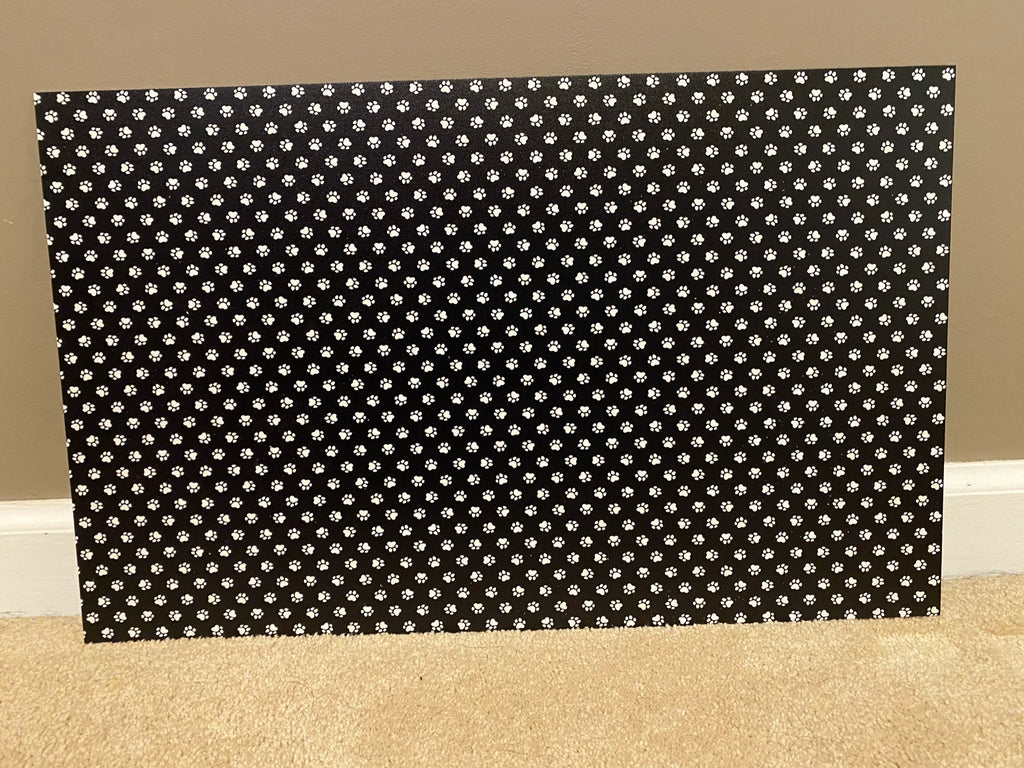 PatternPly® Full Coverage Black and White Paw Prints sheet showing the pattern