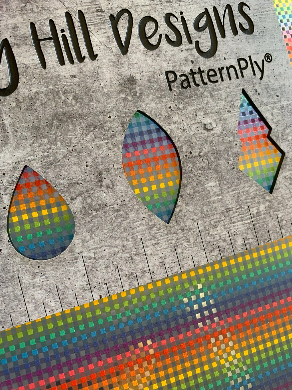 PatternPly® Scattered Micro Rainbow Buffalo Plaid sheet showing the pattern