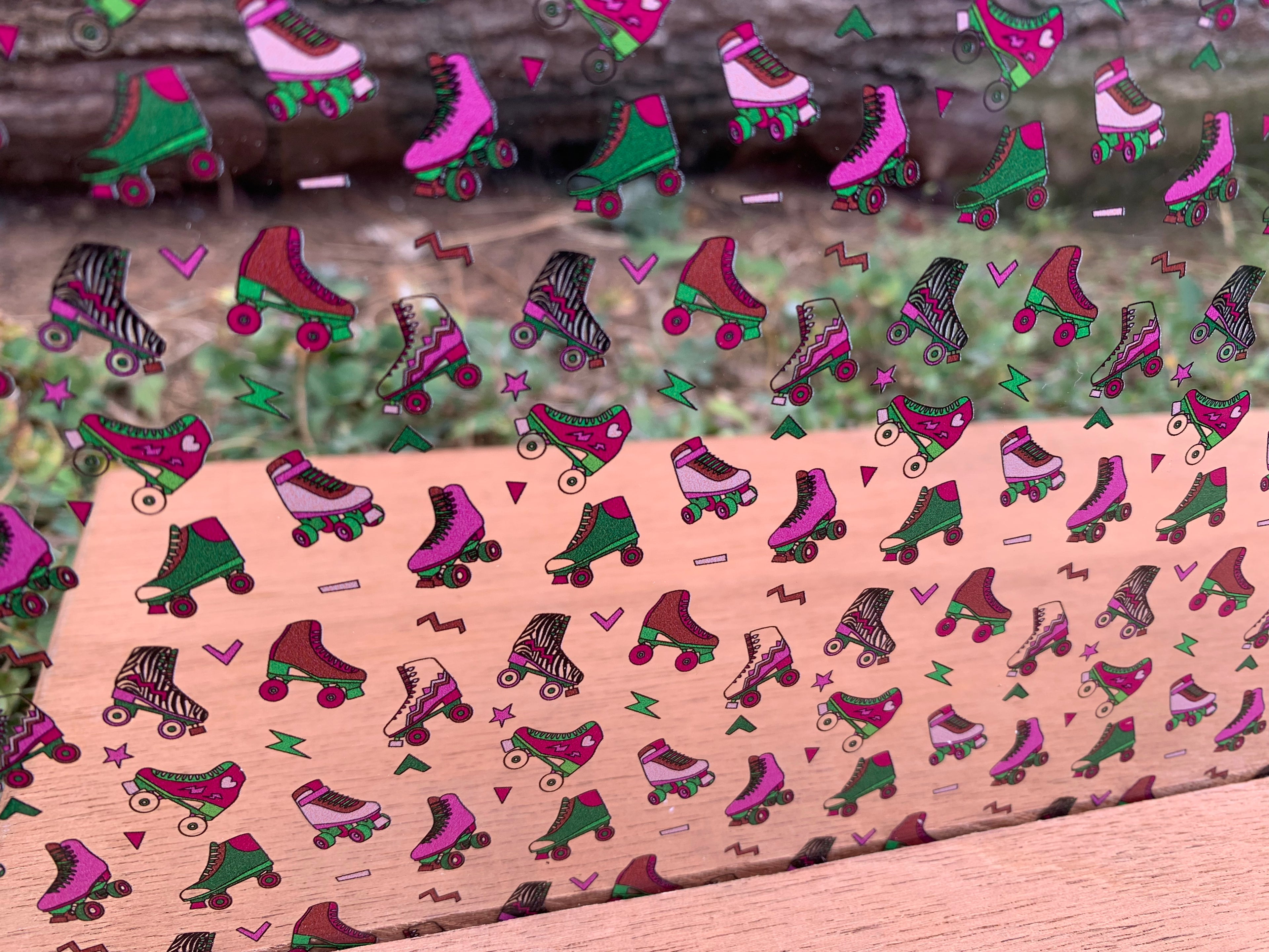 PatternPly® Scattered Pink and Green Roller Skates sheet showing the pattern
