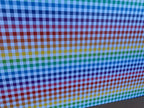 PatternPly® Full Coverage Rainbow Buffalo Plaid sheet showing the pattern