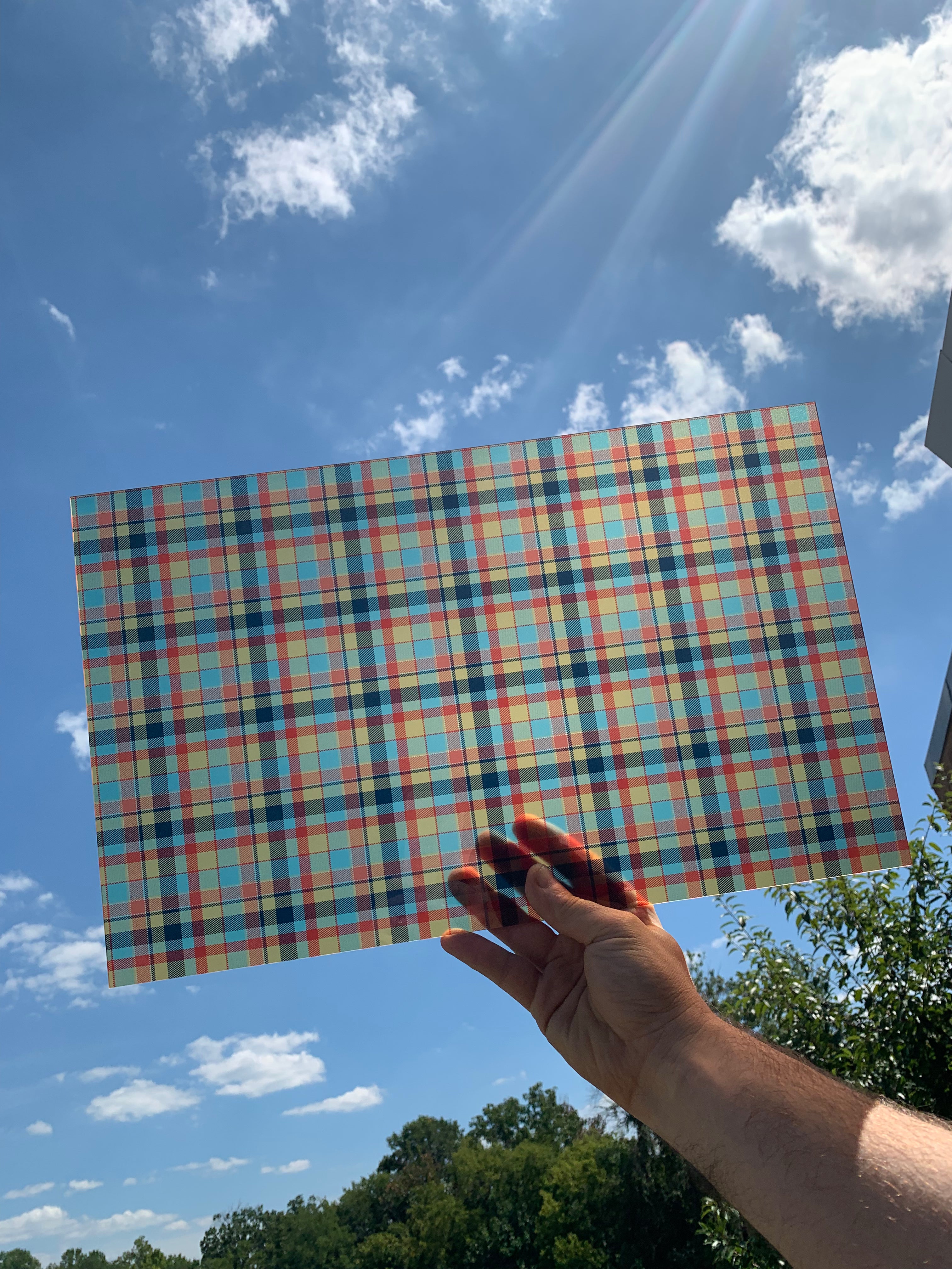PatternPly® Transparent Orange and Blue Plaid sheet showing the pattern