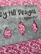 PatternPly® Full Coverage XO Hearts (Pink Background) sheet showing the pattern