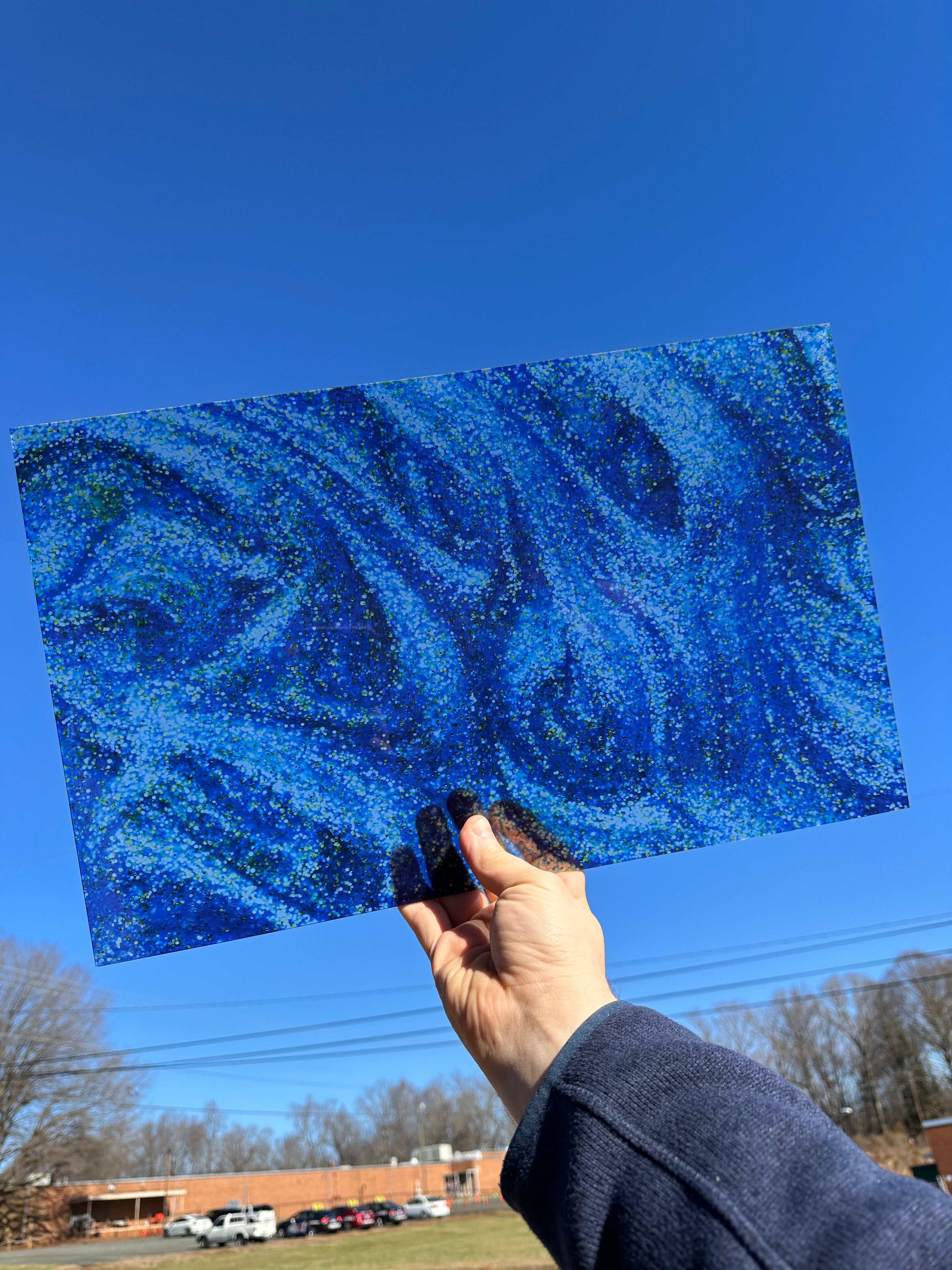 PatternPly® Transparent Chunky Blue Glitter* Swirl sheet showing the pattern