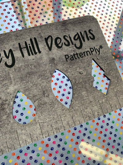 PatternPly® Scattered Micro Rainbow Pawprints