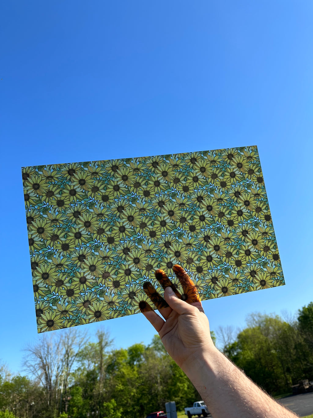 PatternPly® Transparent Sunflowers with Sky sheet showing the pattern