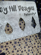 PatternPly® Scattered Navy Blue Snowflakes sheet showing the pattern
