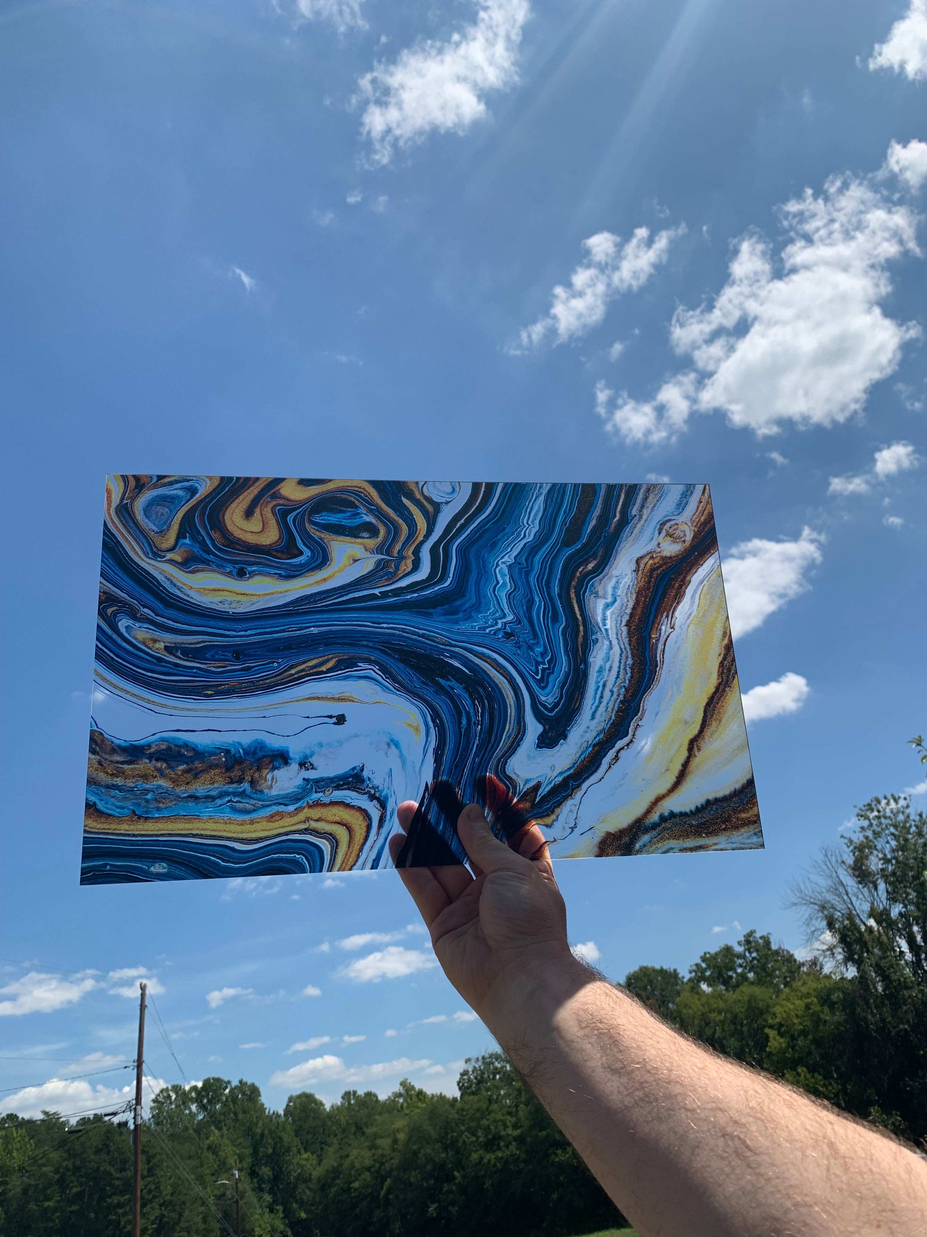 PatternPly® Transparent Blue and Gold Swirl sheet showing the pattern