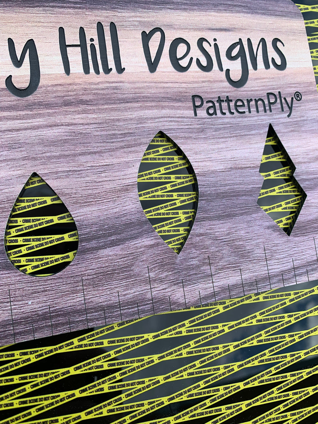 PatternPly® Acrylic Textured Micro Crime Scene Tape on Black sheet showing the pattern