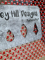 PatternPly® Scattered Santa Hats and Boots sheet showing the pattern