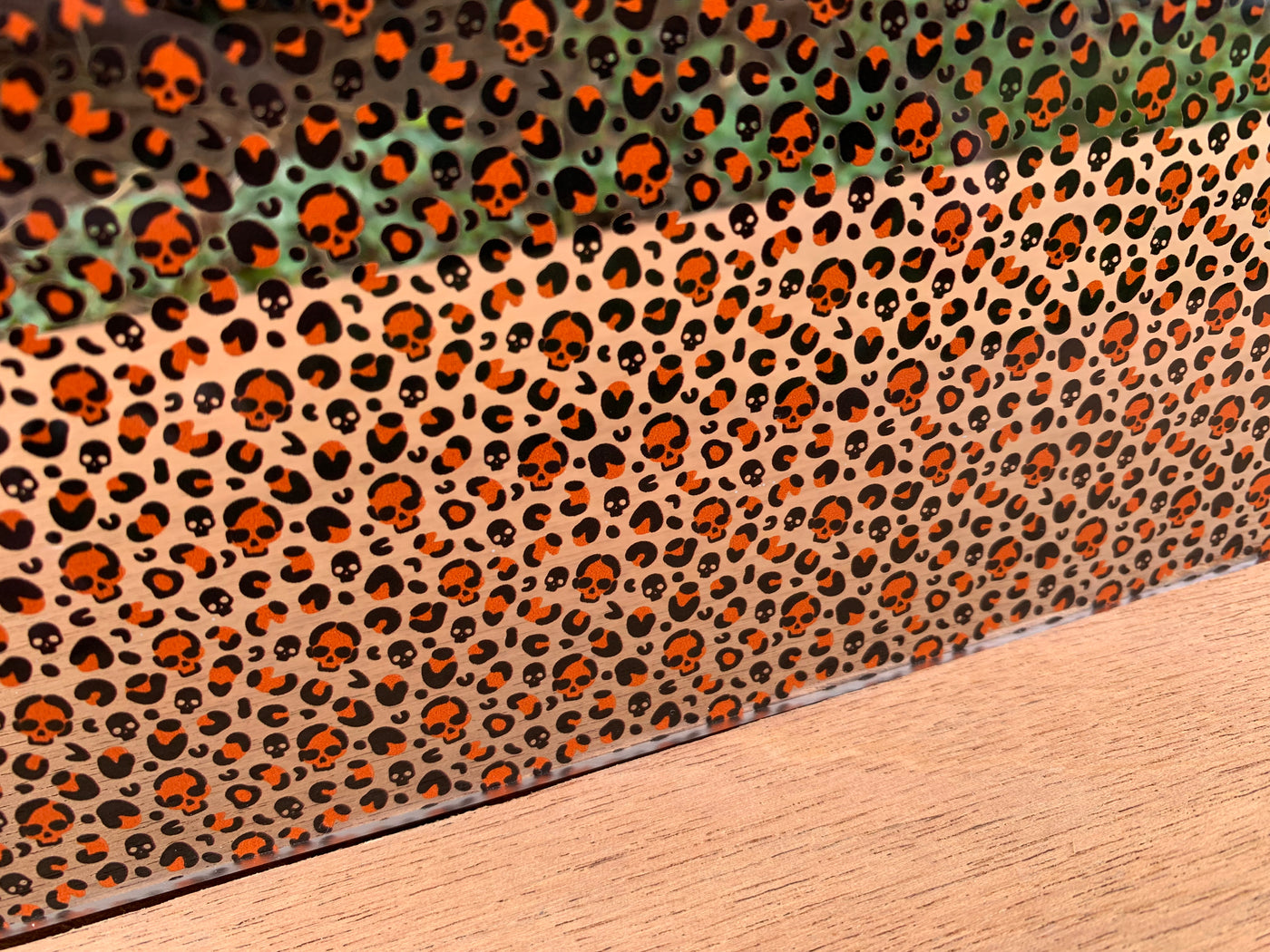 PatternPly® Scattered Orange Micro Skull Leopard
