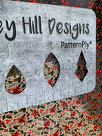 PatternPly® Scattered Pink and Red Poinsettias sheet showing the pattern