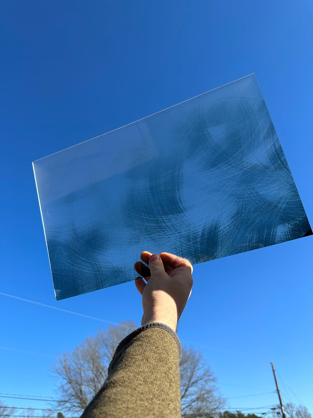 PatternPly® Transparent Swirled Brushed Metal sheet showing the pattern