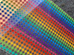 PatternPly® Scattered Rainbow Buffalo Plaid sheet showing the pattern