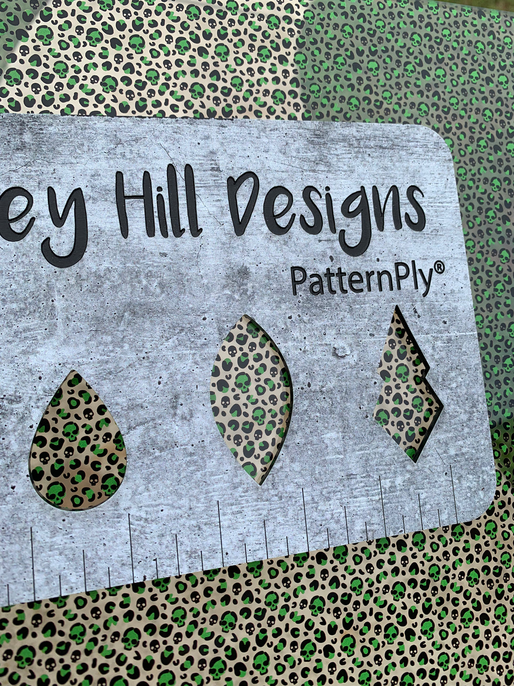 PatternPly® Scattered Green Micro Skull Leopard sheet showing the pattern