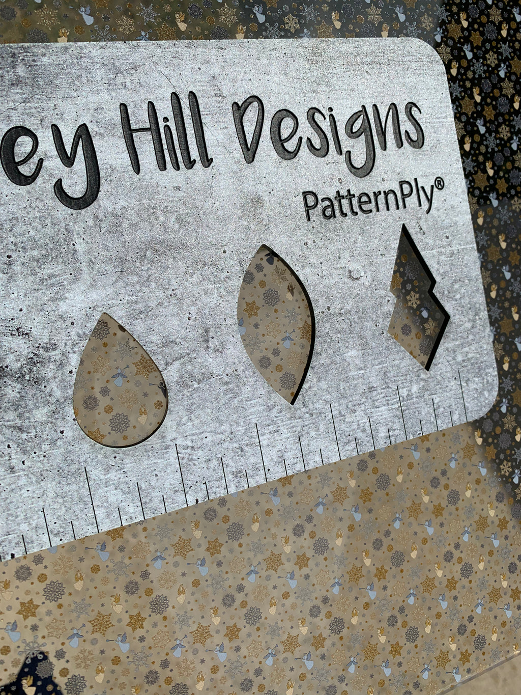 PatternPly® Scattered Silver and Gold Angels and Snowflakes sheet showing the pattern