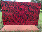 PatternPly® Full Coverage Red, Black, and Green Leopard sheet showing the pattern