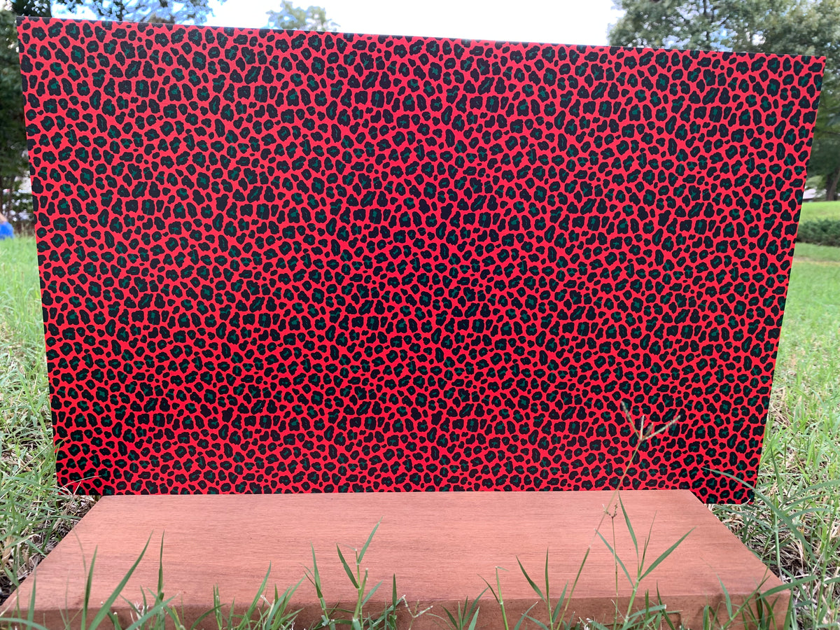 PatternPly® Full Coverage Red, Black, and Green Leopard sheet showing the pattern
