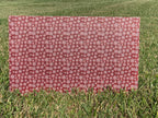 PatternPly® Full Coverage Mini Red Snowflake Buffalo Plaid sheet showing the pattern